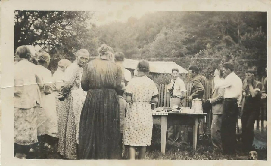 early twentieth century family dinner outside in the the mounatins